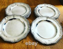 A Magnificent set of Twelve Sterling Silver Royal Victorian Dinner Plates