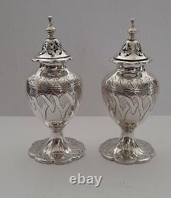 Pair of Silver Casters. Birmingham 1858. Engraved Decoration. 76 gr. Each