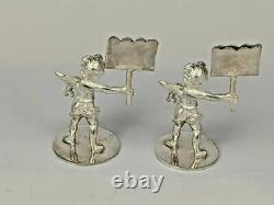 Two solid silver miniature cherub place card holders